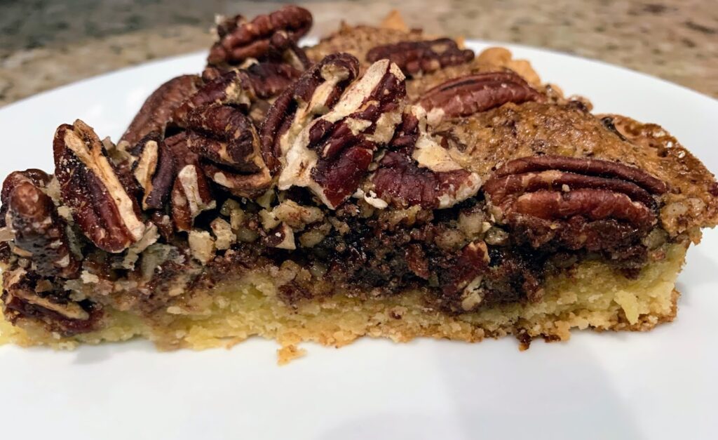 This image has an empty alt attribute; its file name is Chocolate-Pecans-Pie_6-1024x627.jpg